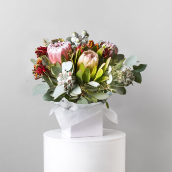 fresh native flowers and foliage arranged in a white short flower box